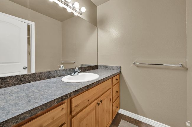 Bathroom featuring vanity and baseboards | Image 15