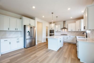 Photo is of the actual home. Gorgeous gourmet kitchen with tons of natural light. | Image 2