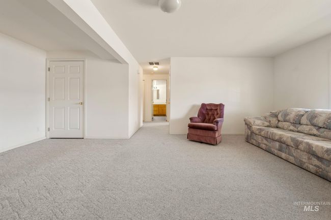 Carpeted living room with baseboards | Image 26