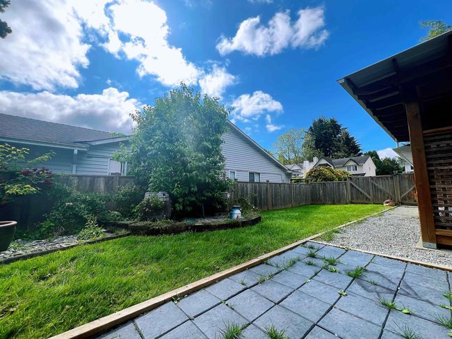 Fenced backyard featuring a patio area | Image 13