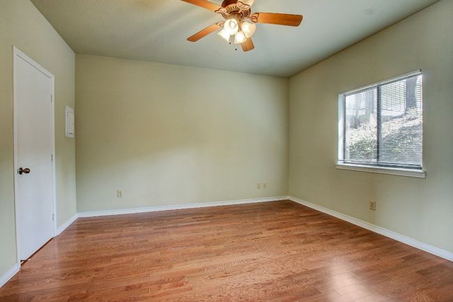 Bedroom with natural light flooding in the large window | Image 18