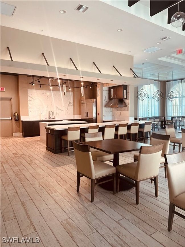 Dining room with light wood-type flooring. community building | Image 40