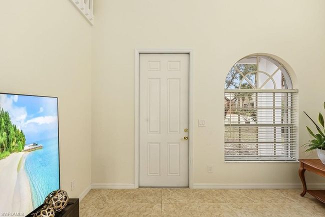 Entryway with baseboards, a healthy amount of sunlight, and tile patterned flooring | Image 28