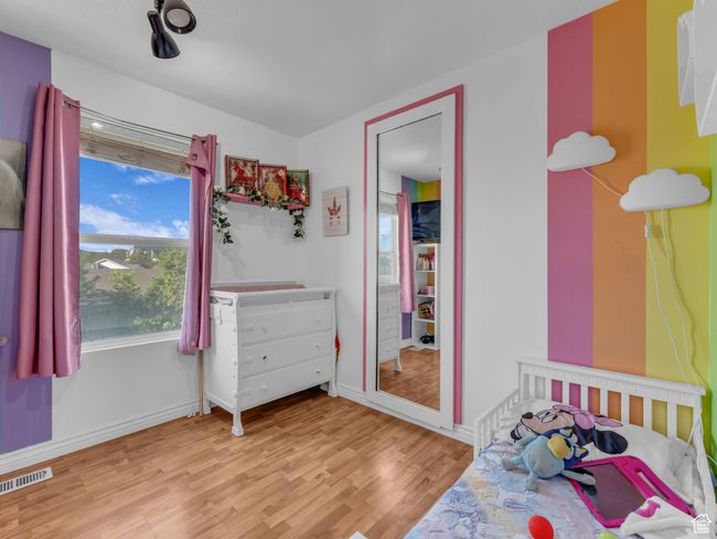 Bedroom featuring wood finished floors and baseboards | Image 27