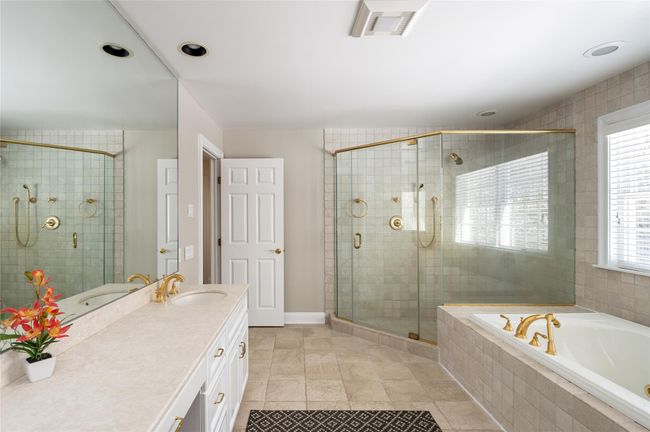 Bathroom with a large shower, a bath, and double vanity | Image 21