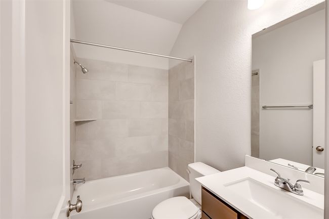 Full bathroom with toilet, vanity, and bathtub / shower combination | Image 25