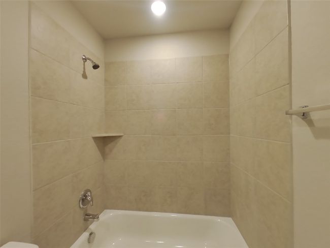 Bathroom with shower / tub combination and toilet | Image 13