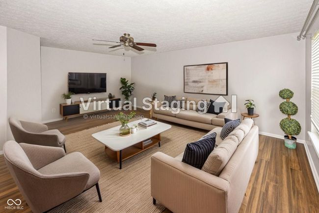 This great room was virtually staged to allow you to visualize a potential furniture arrangement. | Image 19