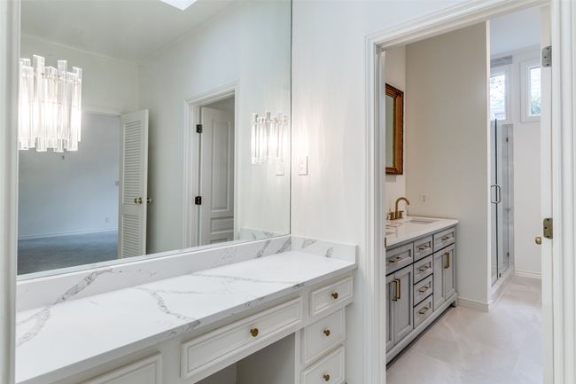 Bathroom featuring vanity and a shower stall | Image 16