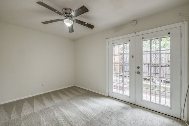 Spare room with french doors, carpet flooring, and ceiling fan | Image 14