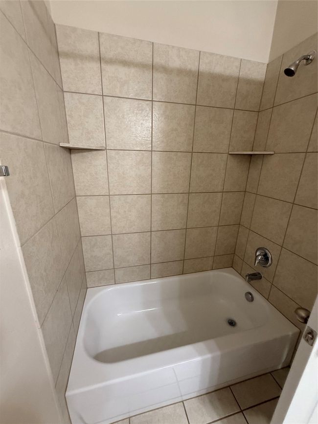 Bathroom with tile patterned floors and shower combination | Image 19