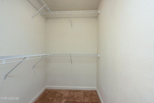 Walk in closet in primary bedroom | Image 16