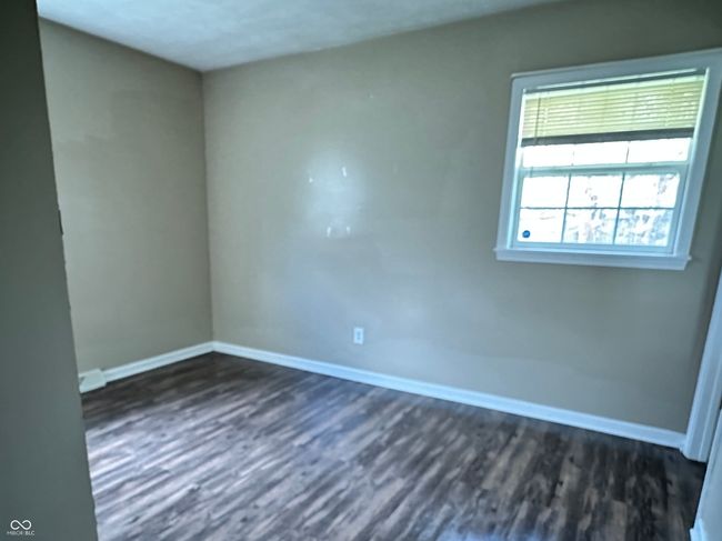 unfurnished room featuring dark wood-style floors | Image 5