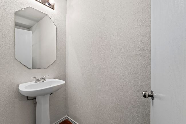 A convenient 1st floor half bath/powder room, great for guests. | Image 14
