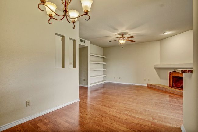 Dining room looking onto the Living Room - beautiful wood floors | Image 10