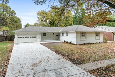 Ranch-style home with a garage | Image 1