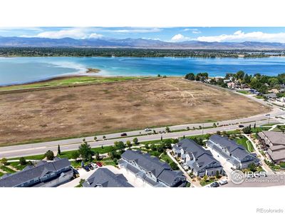 Stunning views of Boyd Lake and the Rocky Mountains from your front patio. | Image 2