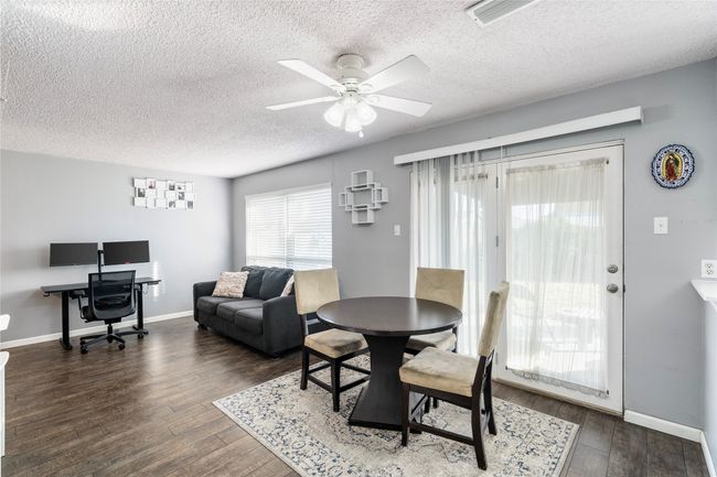 Dining space with ceiling fan, dark hardwood / wood-style floors | Image 12