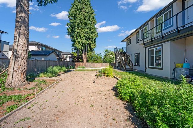 Fenced backyard with stairway | Image 38