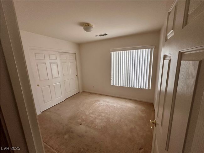 Unfurnished bedroom with carpet and a closet | Image 8