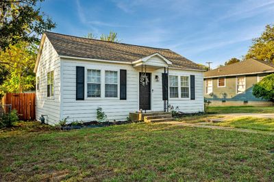 Bungalow featuring a front lawn | Image 1