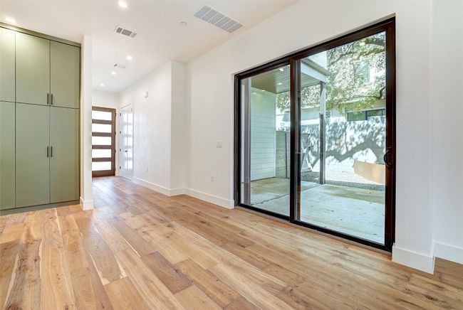 Empty room with light wood-type flooring, baseboards, and recessed lighting | Image 26