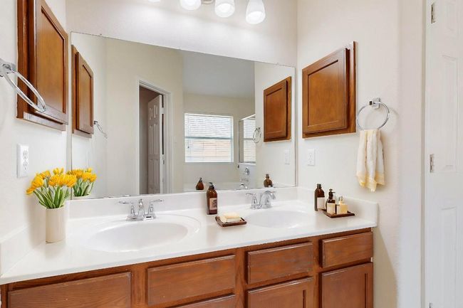 Bathroom featuring double vanity and a sinks and new light just installed. | Image 11