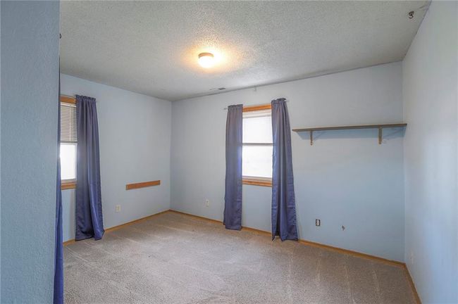 Carpeted spare room with baseboards and a textured ceiling | Image 35