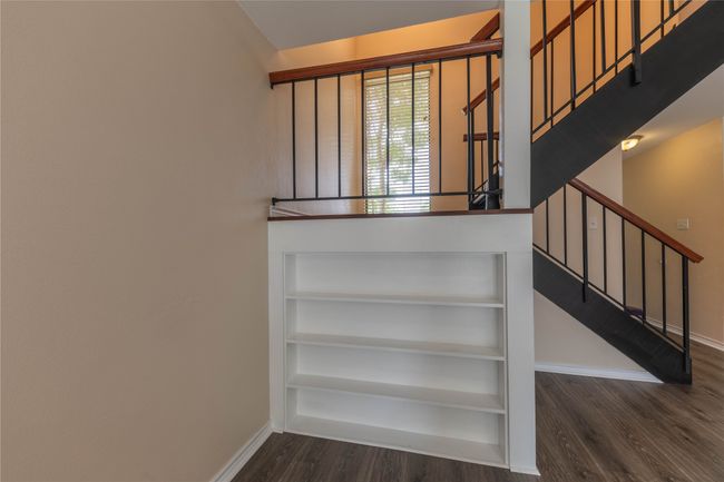 Staircase featuring baseboards and wood finished floors | Image 25