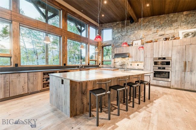 The kitchen is the heart of the home and generously sized for entertaining a crowd. | Image 16