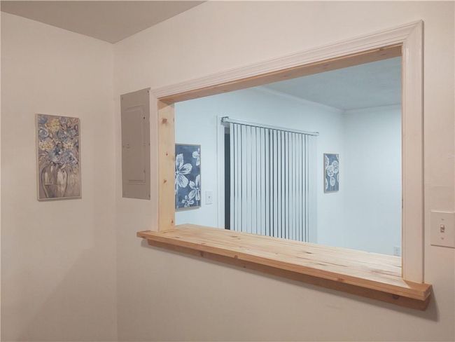 VIEW OF THE SLIDING GLASS DOORS FROM THE KITCHEN AREA. | Image 4