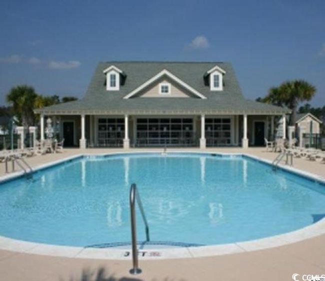 Community pool with a patio | Image 32