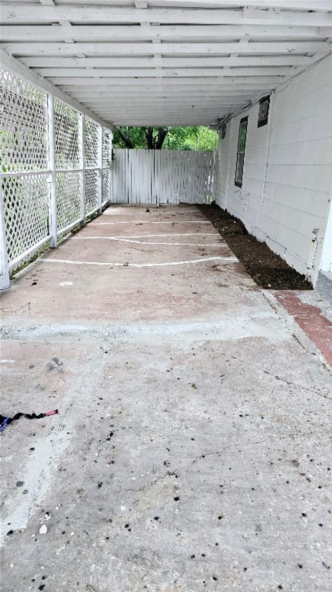 View of patio featuring fence and a carport | Image 40