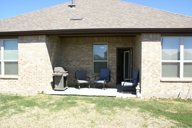 Back of property featuring a patio, a lawn | Image 19