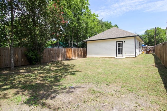 View of fenced backyard | Image 21
