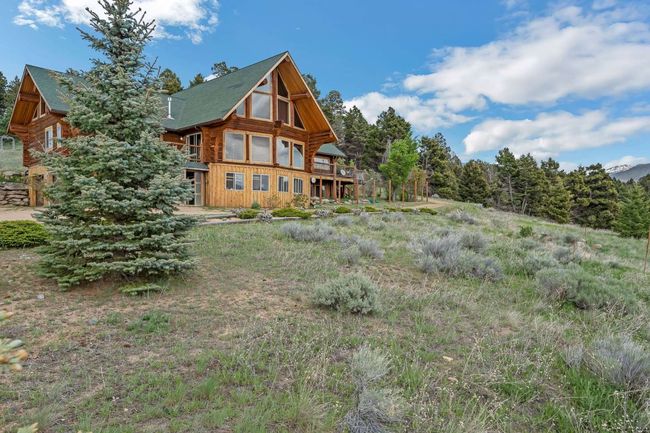 Rear view of house featuring log siding | Image 7