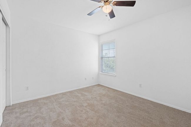 Spare room featuring carpet, ceiling fan, and baseboards | Image 23