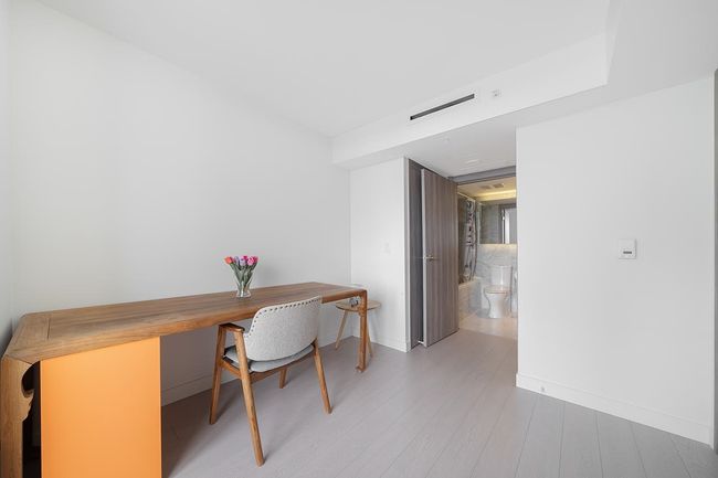 Office with wood finished floors and baseboards | Image 8