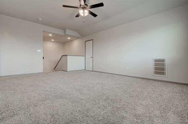 Unfurnished room featuring a ceiling fan, recessed lighting, carpet, baseboards, and vaulted ceiling | Image 21