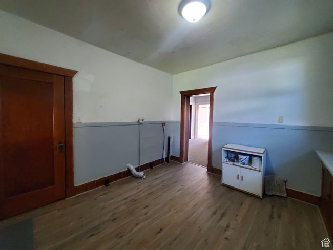 Unfurnished room featuring wood finished floors | Image 6