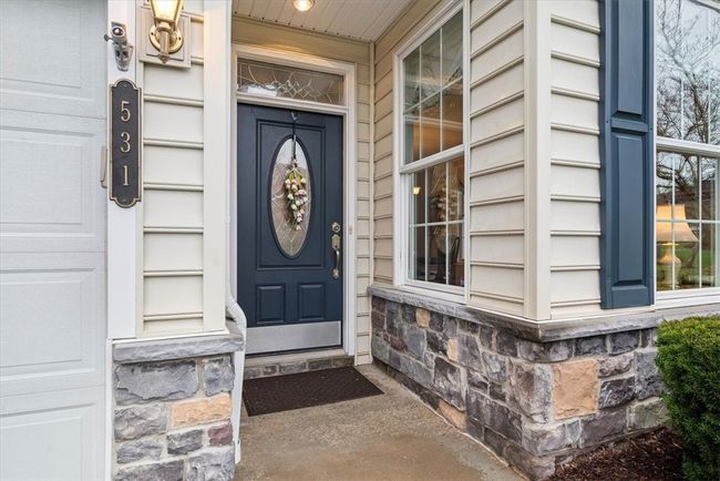A covered entry with tone surround keeps guests out of the weather elements when they come to visit. | Image 5