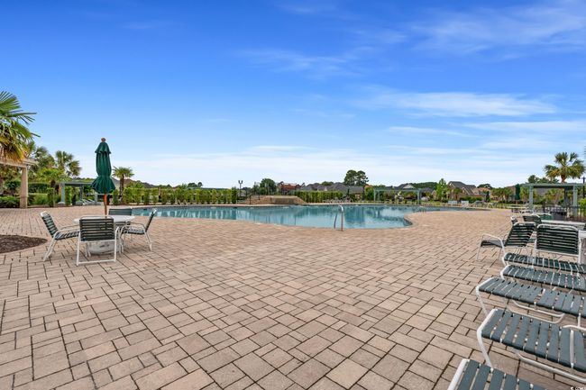 Community pool featuring a patio area and a pergola | Image 11