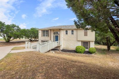 Nestled in the highly sought-after Lago Vista community, this meticulously-maintained home sits on a generous .329-acre lot, offering breathtaking panoramic hill country views. | Image 2