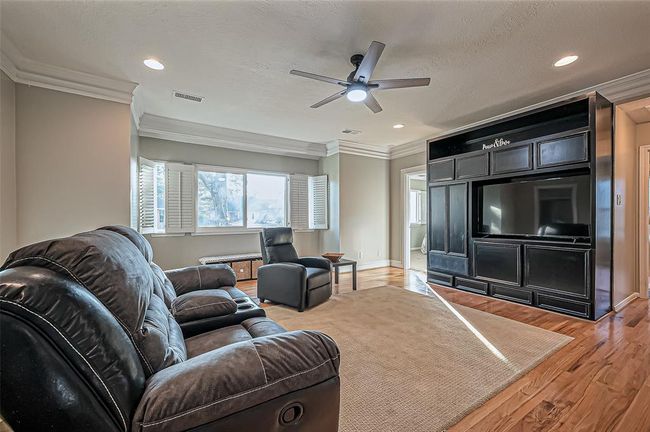 Upstairs features a spacious game room with a view over the living area. | Image 33