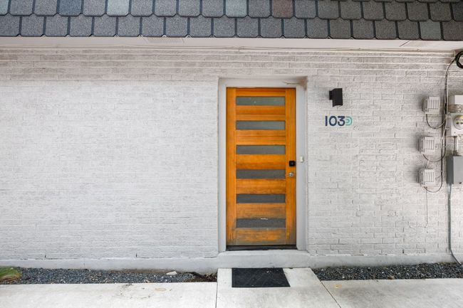 Property entrance with brick siding | Image 6