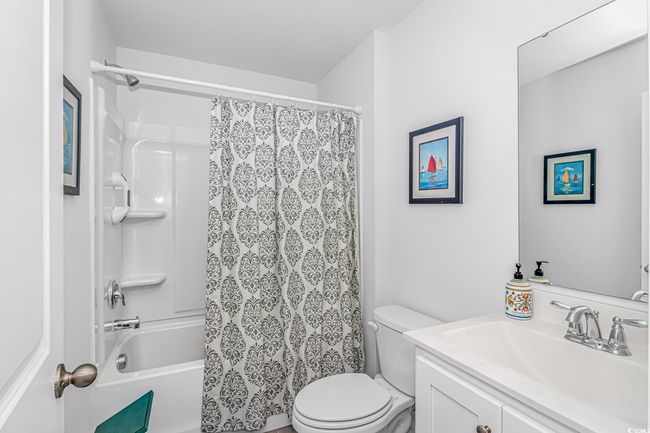 Full bathroom featuring vanity, shower / bath combo, and toilet | Image 15