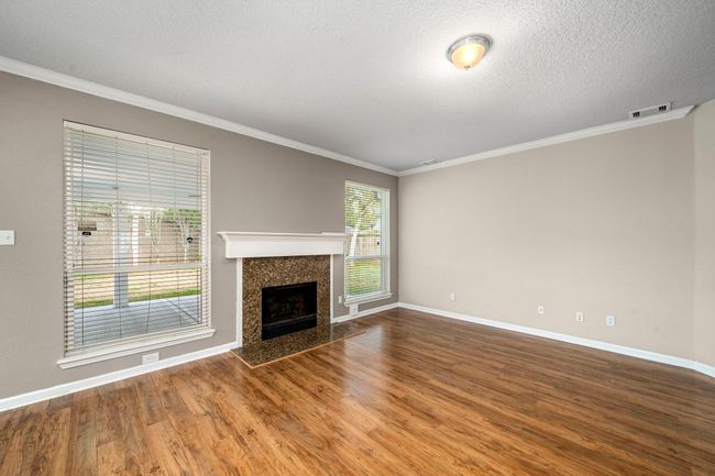 Another perspective of the family room with views to the backyard. | Image 12
