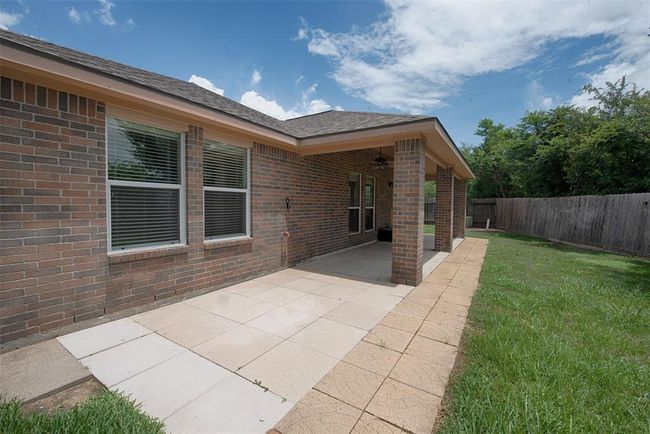 At the end of the patio is a great area to set up lawn chairs and work on your tan. | Image 32