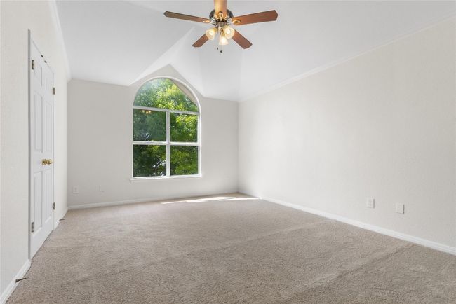 Spare room with carpet, a ceiling fan, and lofted ceiling | Image 14