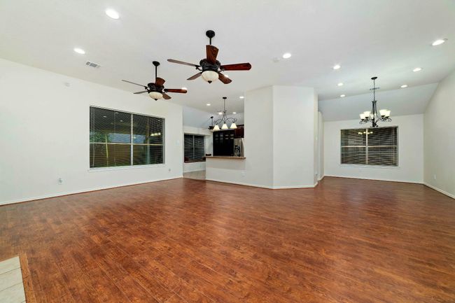 From the family room, one can fully appreciate the open-concept design that extends seamlessly throughout the living areas of the home. | Image 17